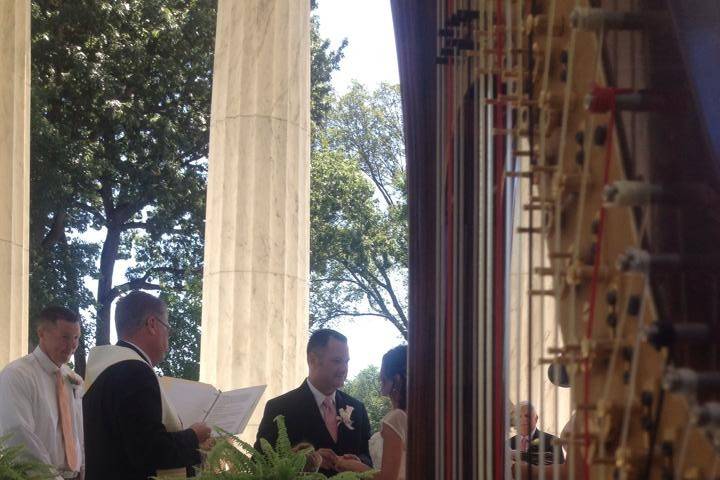 Playing harp at a wedding