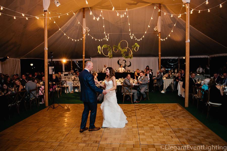 Globe lighting and white band backdrop