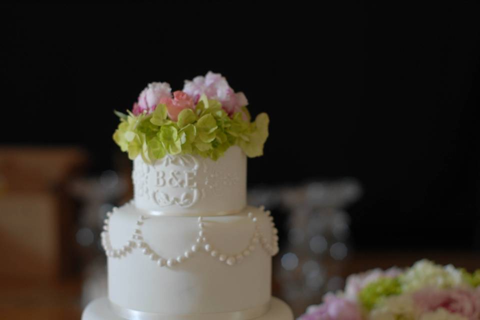 White on White Wedding Cake with Monogram and Pearls.