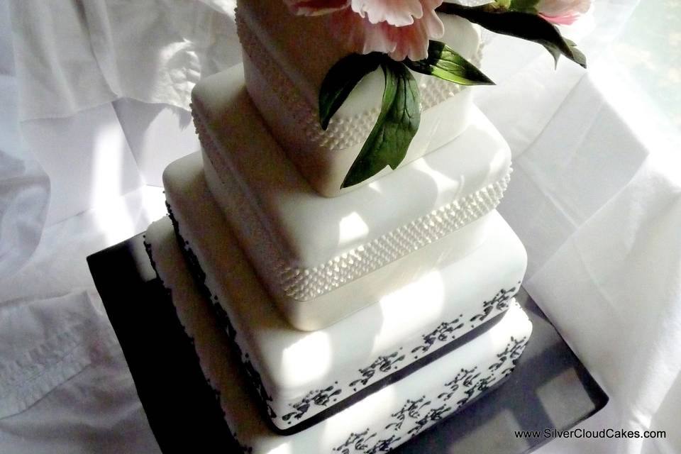 Sugar Peony topper on a beautifully piped wedding cake.