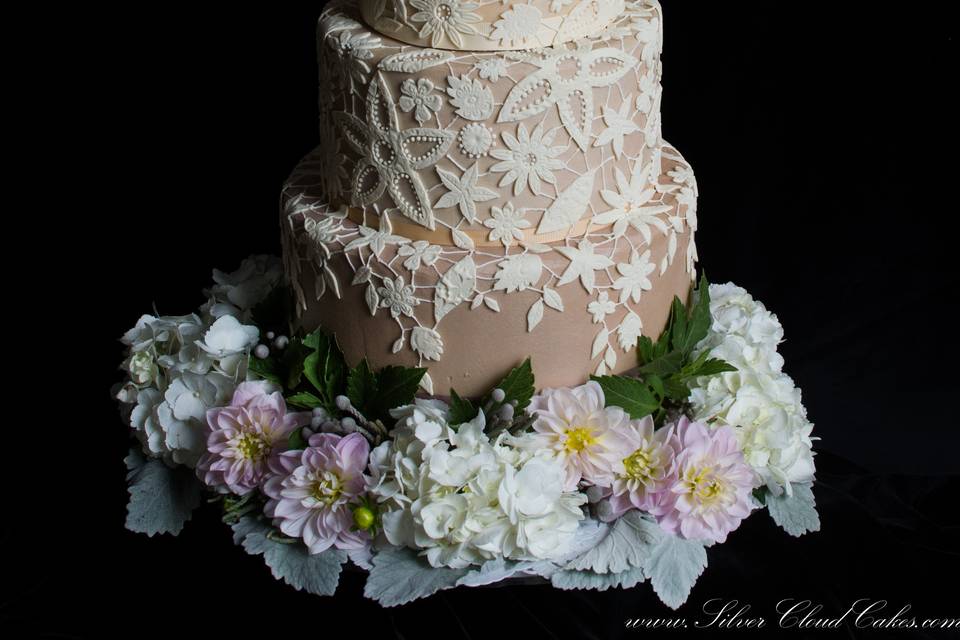 Handcrafted White Chocolate Guipere Lace covers this Ganache finished Wedding Cake.