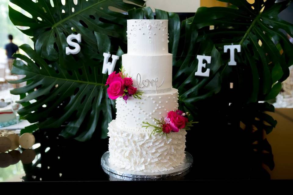 Four tier cake with pink flowers