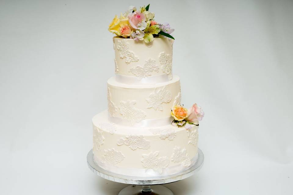 Three tier cake with flowers on top