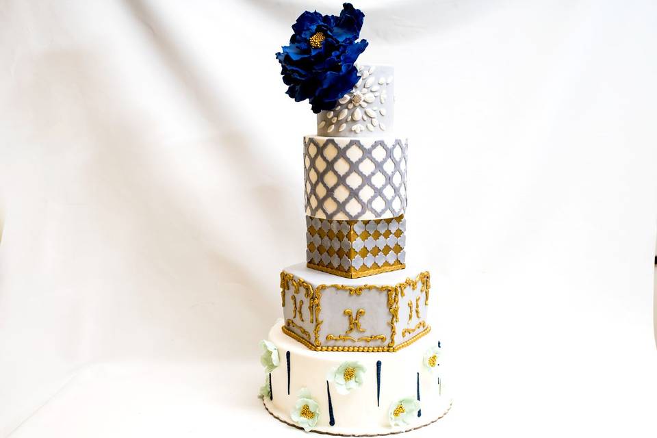Five tier white and gold cake