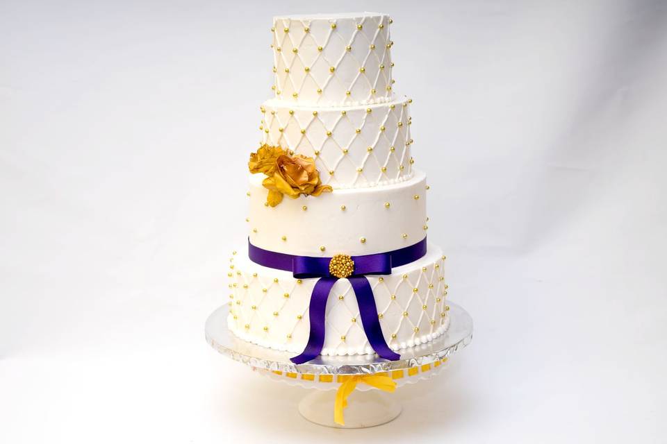 Wedding cake with purple ribbon