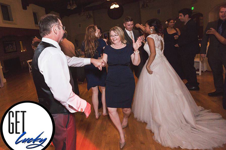 Couples and guests dancing