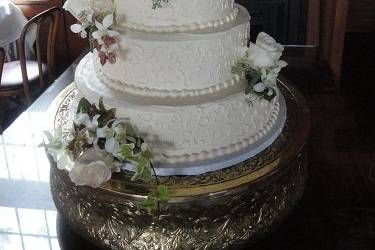 Four tier wedding cake with white flowers