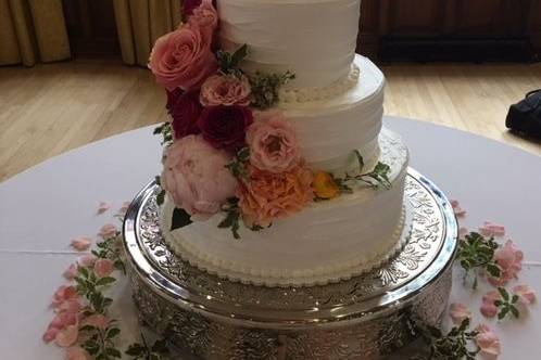 Three tier cake with ascending flowers
