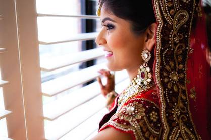 Indian bride peering from window