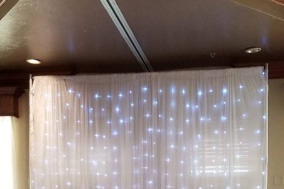 Illuminated fairy light draping