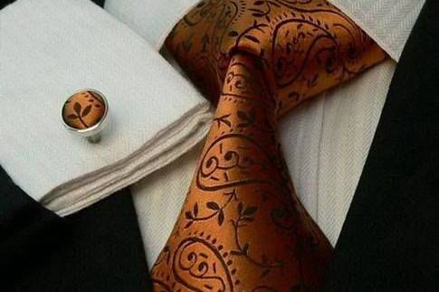 Orange tie, handkerchief, and pin