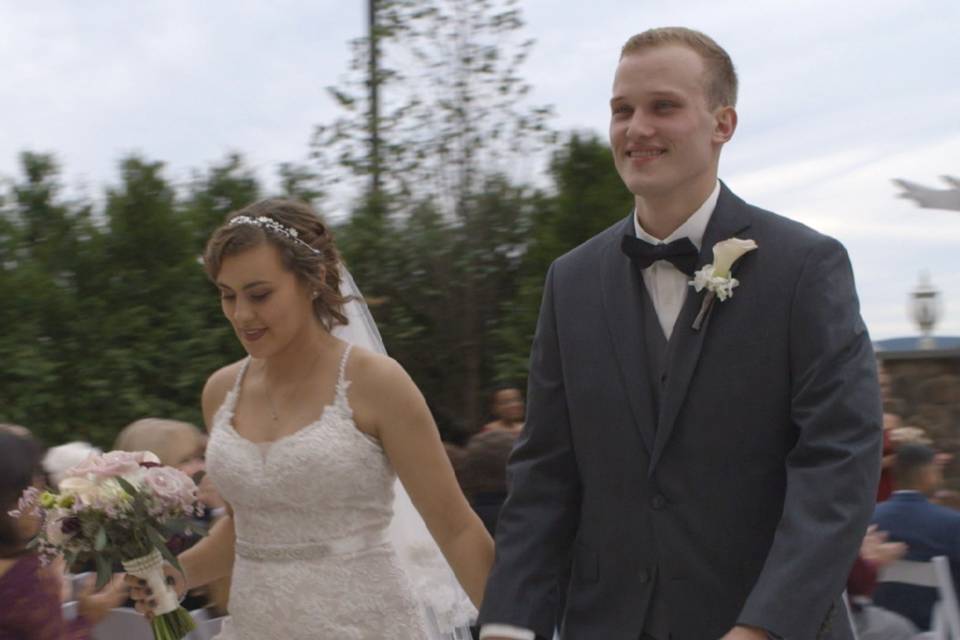 Young couple rushing down the aisle