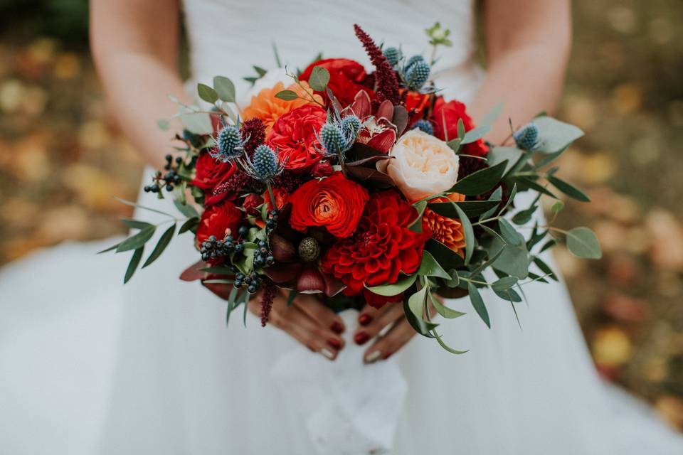 Romantic fall Oregon bridal bouquet on private estate. Garden roses, dahlias, textures and mixed greenery complete this look.  Photo courtesy of Hazelwood Photo
