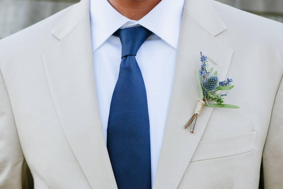 Lavender and sea holly boutonniere at The Aerie at Eagle Landing. Photo courtesy of Becca Blevins Photography