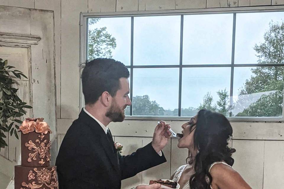 Bride and Groom eating cake