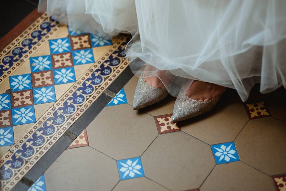 Pointed shoes on tile floor