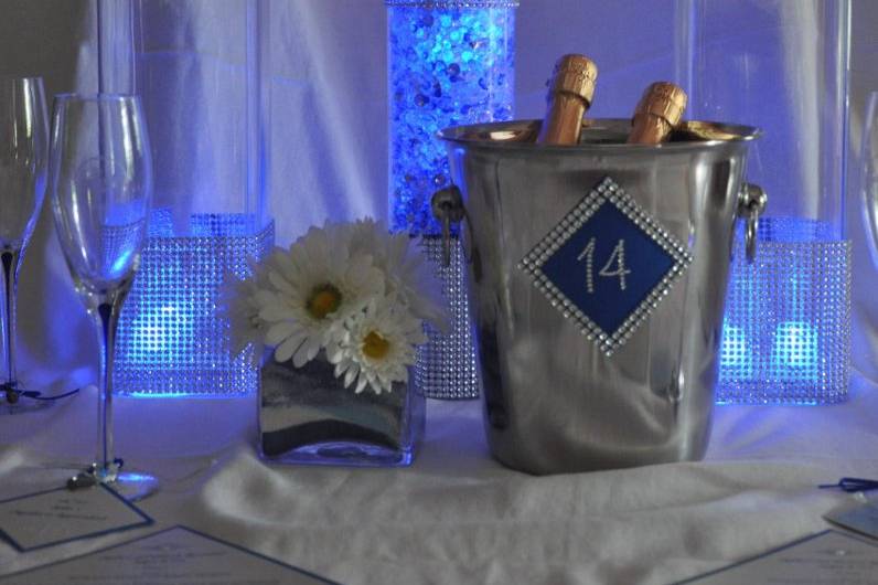 Sapphire blue and clear diamond confetti and diamond wrap were used to make this beautiful centerpiece.