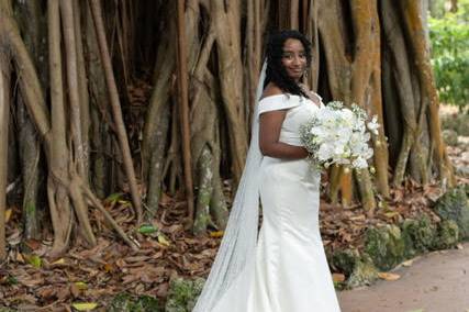 Bride in front of trees