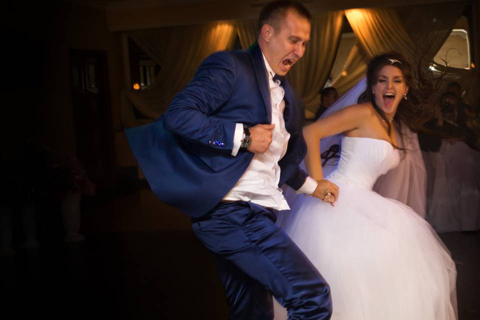 Bride and groom having fun