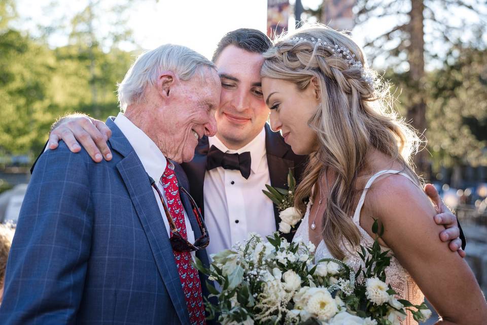 Newlyweds with grandpa.