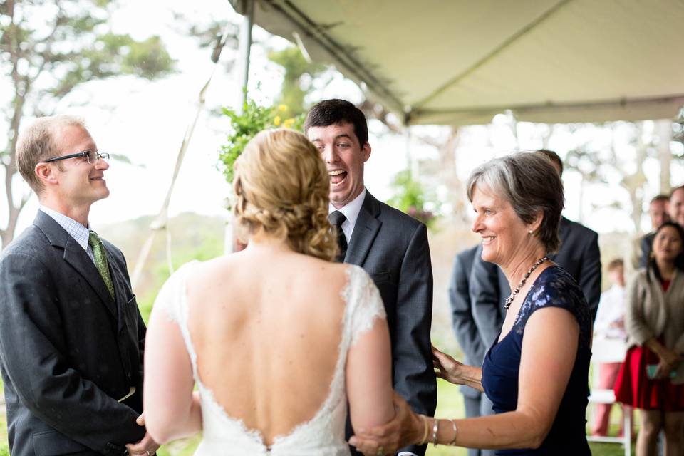 Father of the groom hugging