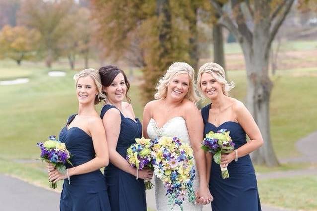 Smiling bride and bridesmaids