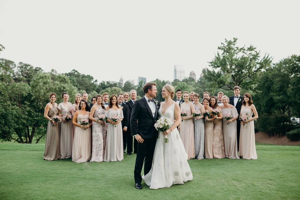 The couple with the bridesmaids and groomsmen