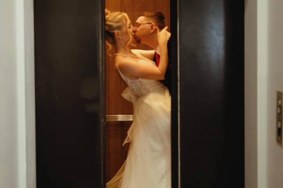 Romantic kiss in the elevator.