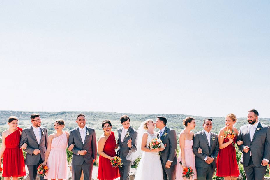 The couple with the bridesmaids and groomsmen