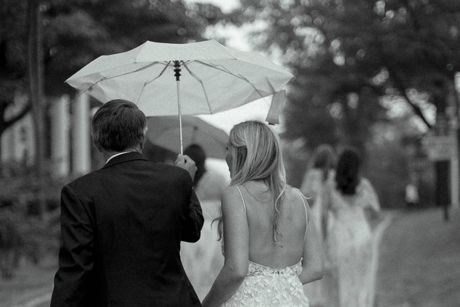 Dad and bride in the rain