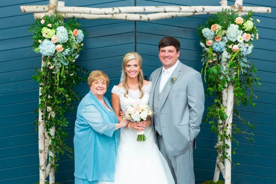 The newlyweds with the mother of the bride