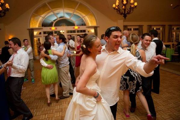 Newlyweds and their guests dancing