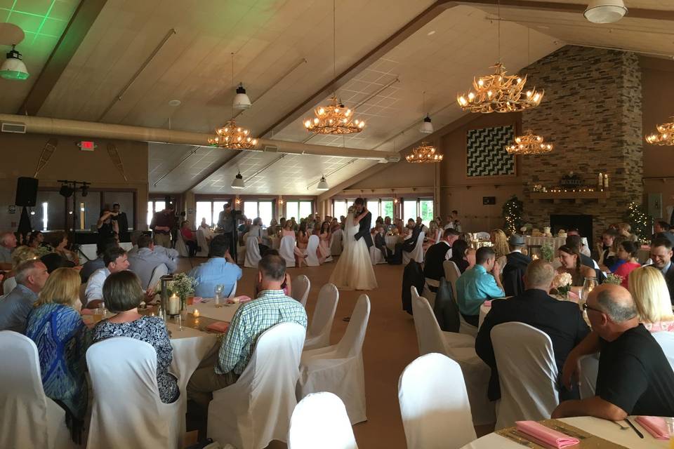 Guests watching the couple dance