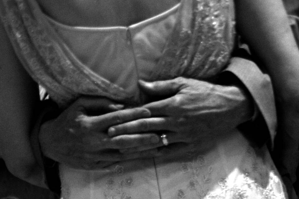 I love to look for close-up details like the hands against the beaded dress during this first dance.