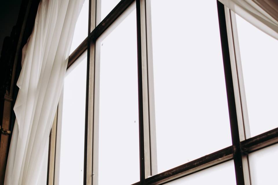 Bride in front of window
