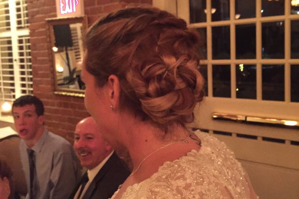 Braid switched after first dance into a twisted bun 'do
