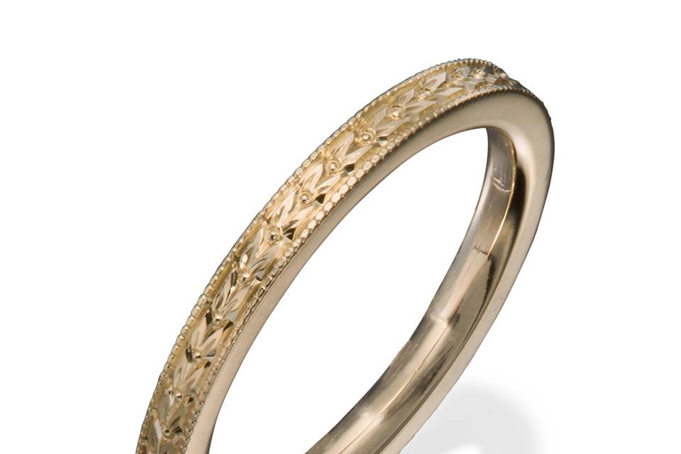 A lady's classic eternity band with round diamonds in shared prong settings.