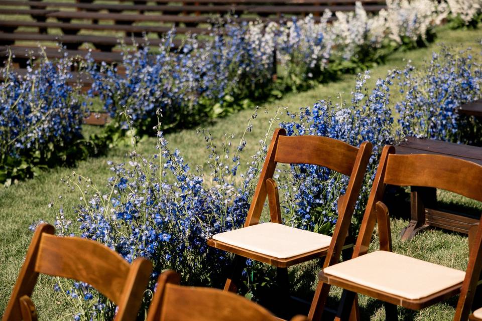 Blue ceremony aisle floral