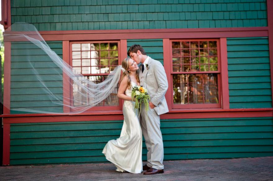 Groom kissing his bride