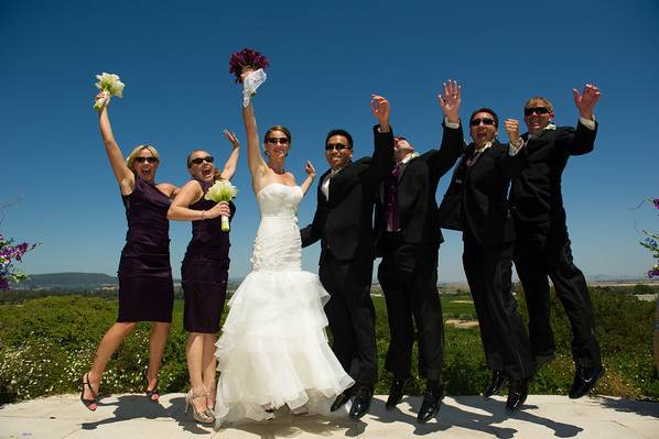 The couple with their groomsmen and bridesmaids