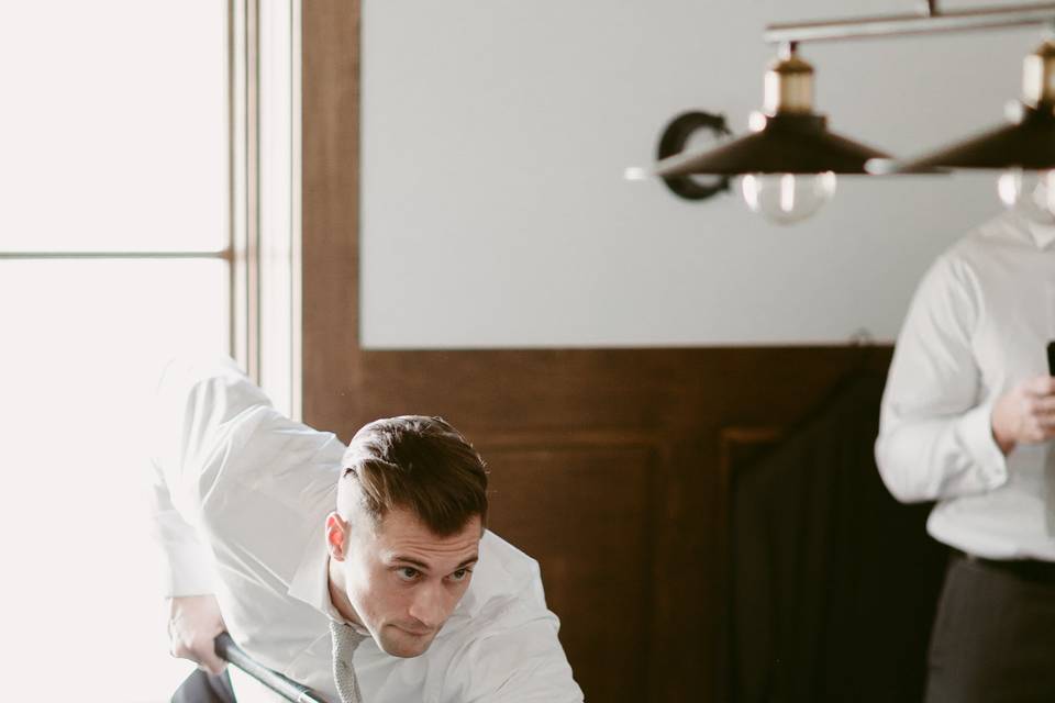 Groom playing billards - Blue Vinyl Creative