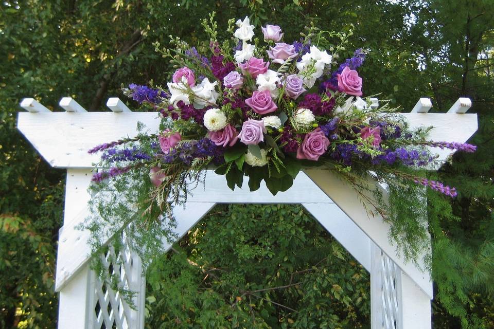 Detail of arbor decoration - grapevine and greens are simple and ecofriendly.