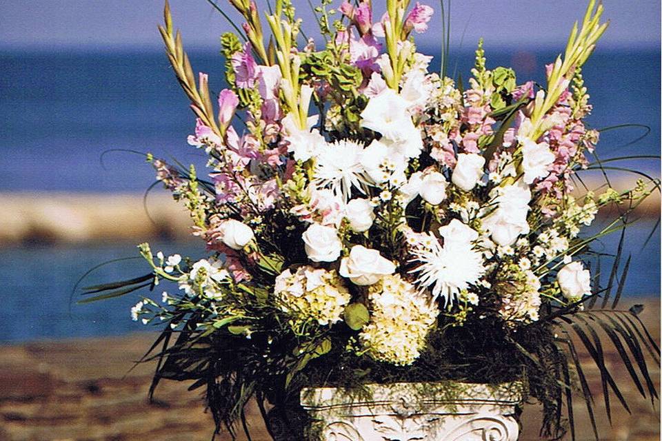 Classic arrangement on a pillar.  A pair marks the ceremony space.