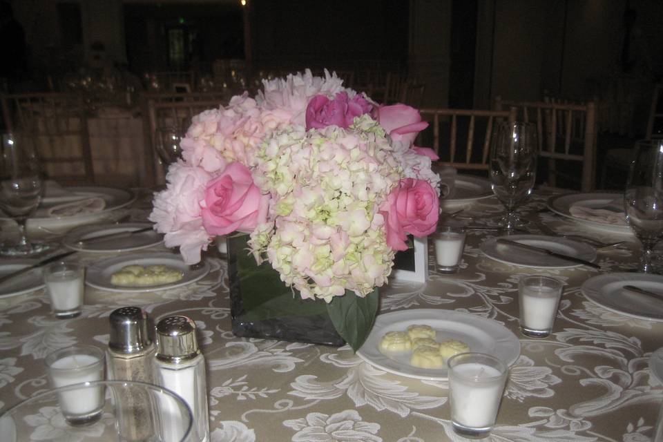 Mixed pinks in roses, gerbera daisy, peonies, with green hypericum berry