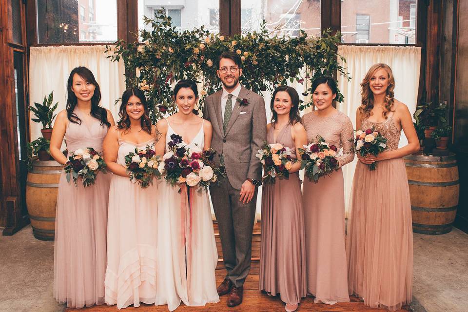 Couple with bridesmaids