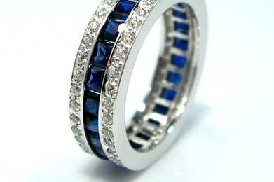 5A Quality Triple Layer CZ Eternity Ring set in 9-18 karat gold! Blue or Pink Sapphire Center Channel.