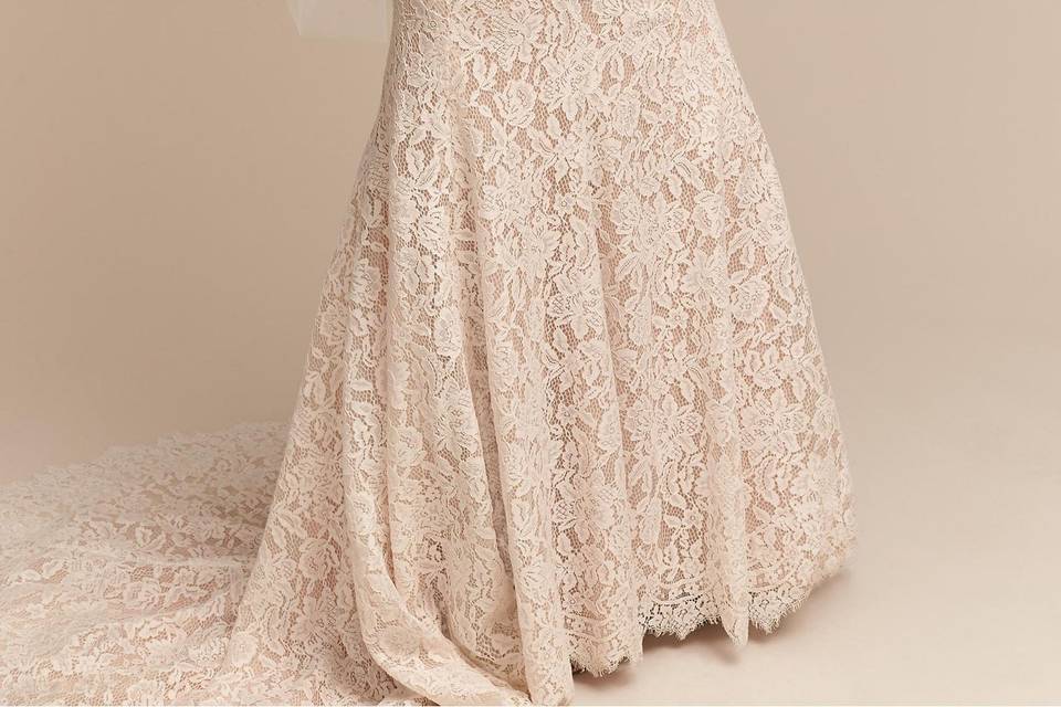 BHLDN Carson Gown		Floral lace stuns in this ultra-flattering mermaid fit. A blossom-trimmed v-neck and illusion lace straps offer a modern touch, but it's the sheer back detailing, infinite buttons, and dramatic train that leave an impression.