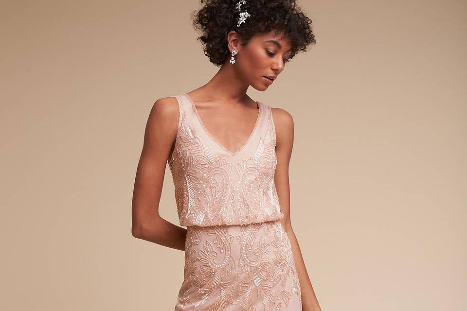 twobirds Bridesmaids	BHLDN Maya Dress	<br>	Universally flattering and super easy to wear, this chic maxi dress features a wide ruffle that can be styled five different ways: at the shoulder, off the shoulder, one shoulder, with straps, or without straps. A detachable sash defines the waist.