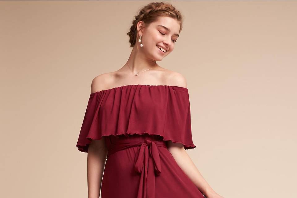 BHLDN 	BHLDN Thrive Dress	<br>	Lustrous velvet elevates an effortlessly chic wrap dress. We love the flouncy sleeves and ruching at the shoulders.