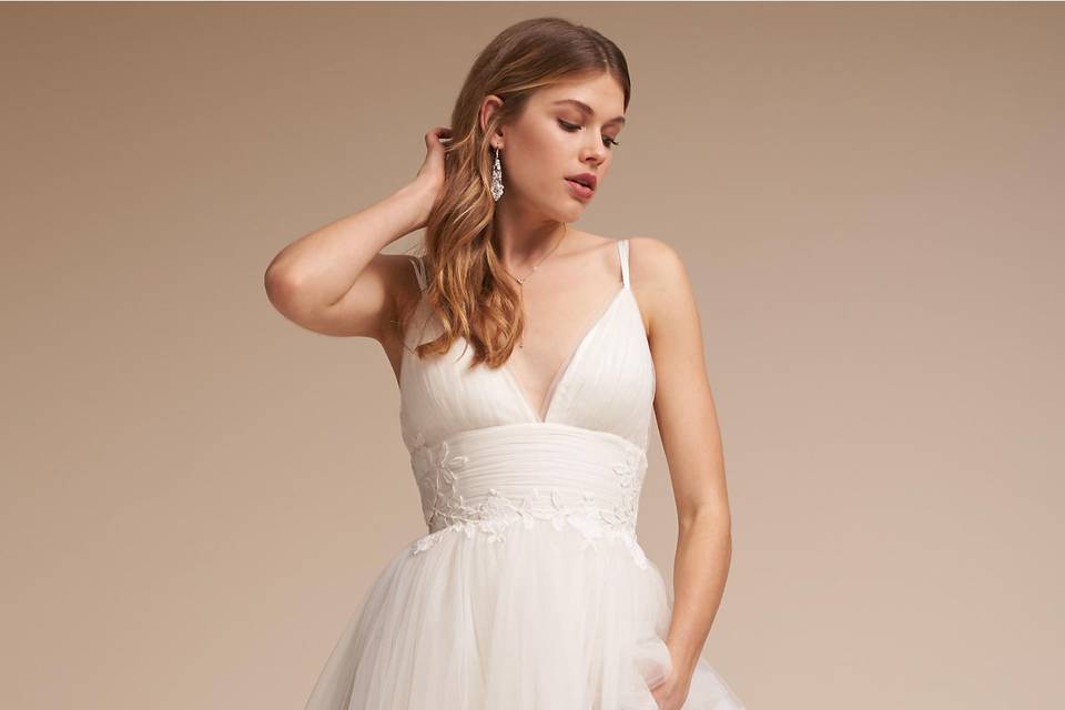 Catherine Deane	BHLDN Melrose Gown	<br>	Raw-edge tulle is fashioned into an A-line silhouette for a gown that’s equal parts refined and ethereal. Floral appliqué trickles down the straps and deep-v bodice.